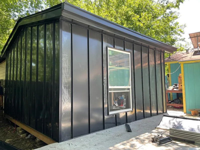 Black standing seam metal wall panels for Roof Inspection in River Grove